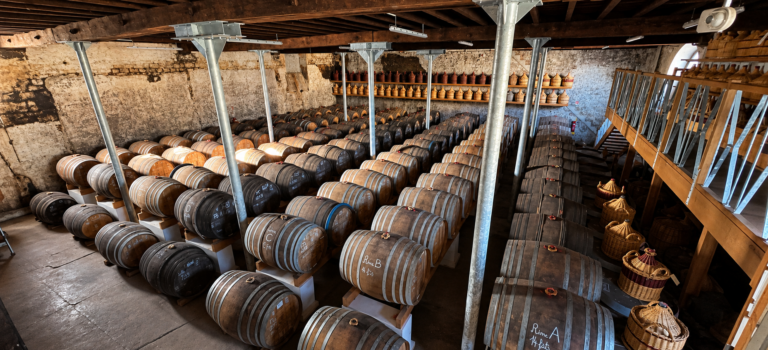 When Does a Cognac Stop Ageing? A Cognac warehouse with casks and demijohns